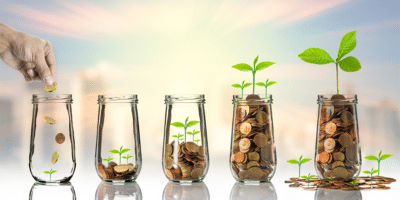 coins in jars, plants from coins, savings growth concept